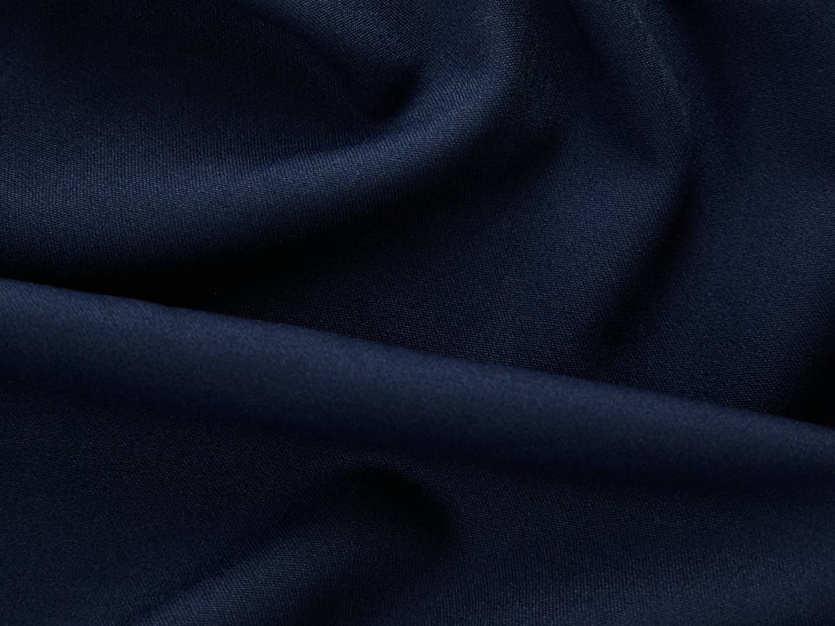 Deep navy premium fabric — every detail executed with precision